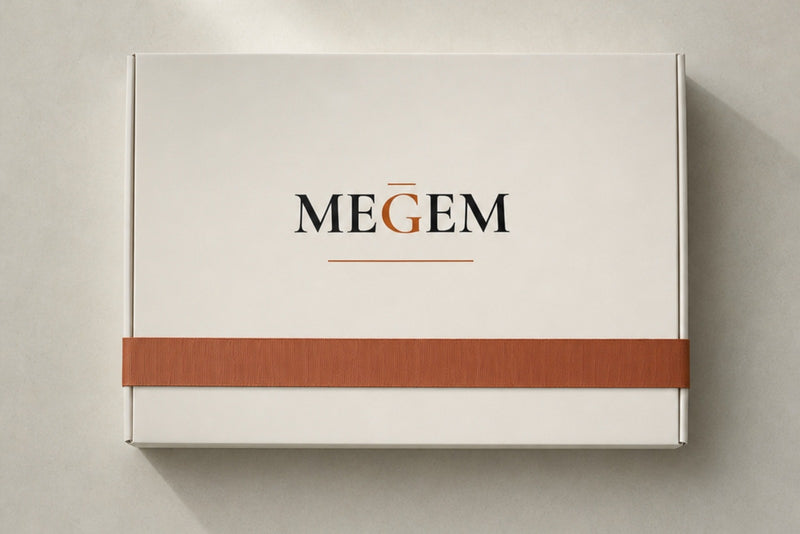MEGEM gift box tied with a copper ribbon, ready to give